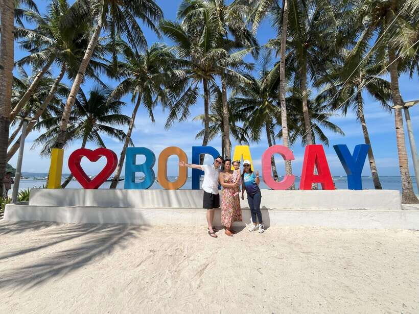 2-Hour Boracay Land Tour via Etrike - Stop 5: Puka Shell Beach sign photos and quick relax time