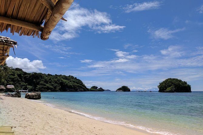 Boracay Island Hopping + Hot Kawa + Parasailing + Helmet Diving - Ilig Iligan Beach: A Short, Scenic Swim Window