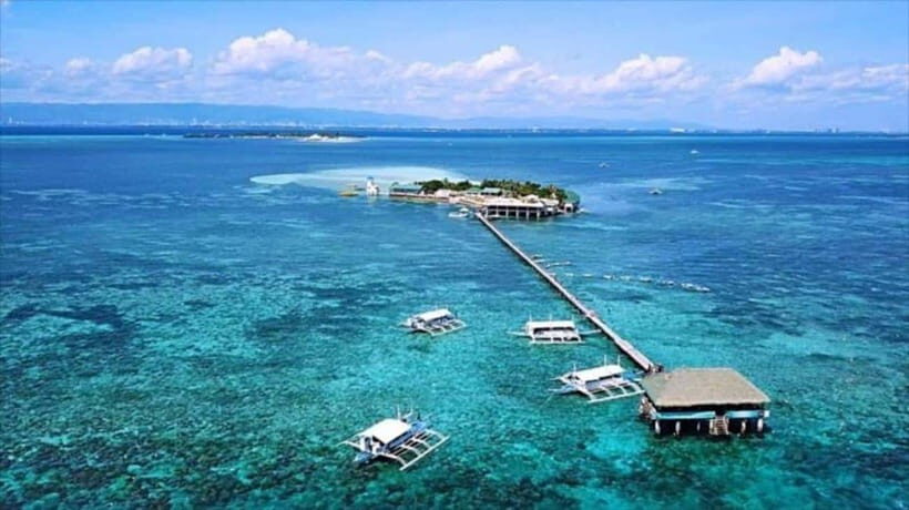 Cebu: Mactan Island Hopping Boat Tour with Lunch - Caohagan Island beach time: white sand, swimming, and local flavor