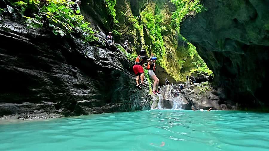 Cebu: Osmeña Peak and Kawasan Canyoneering Day Tour - Kawasan Falls Canyoneering: Jumps, Slides, and Swimming in Turquoise Water