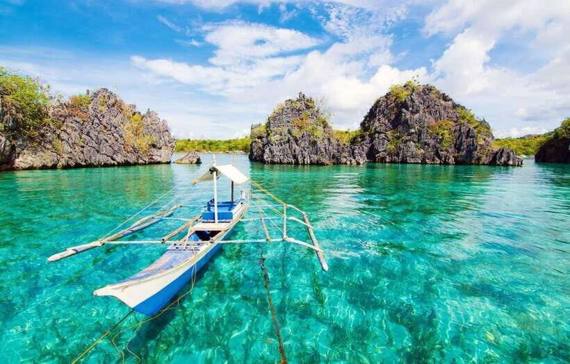 Coron: Coastal Cliffs, Beach & Malcapuya Island Hopping Tour - Malcapuya Island snorkeling: clear water and serious color