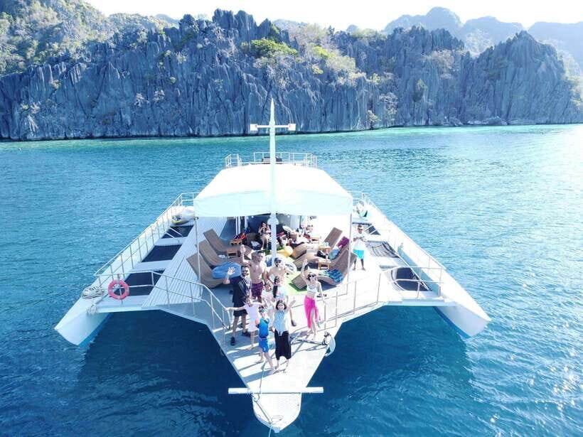Coron Island: Premier Trimaran Tour - CYC Beach stop: BBQ, drinks listed for the day, and real time to relax