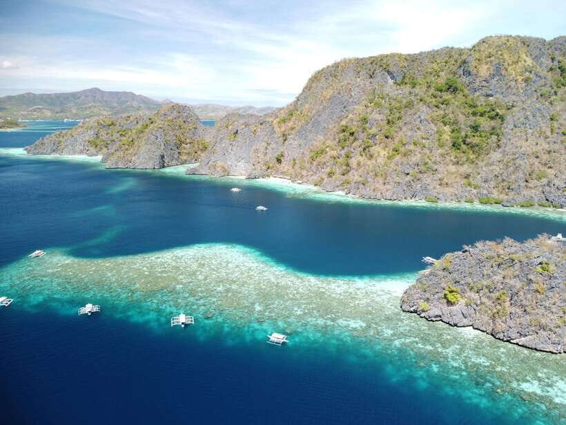 Coron: Island Tour B w/ Snorkeling & Lagoon Adventures - Twin Lagoon: Swim Through the Narrow Opening (and Plan for Water Access Rules)
