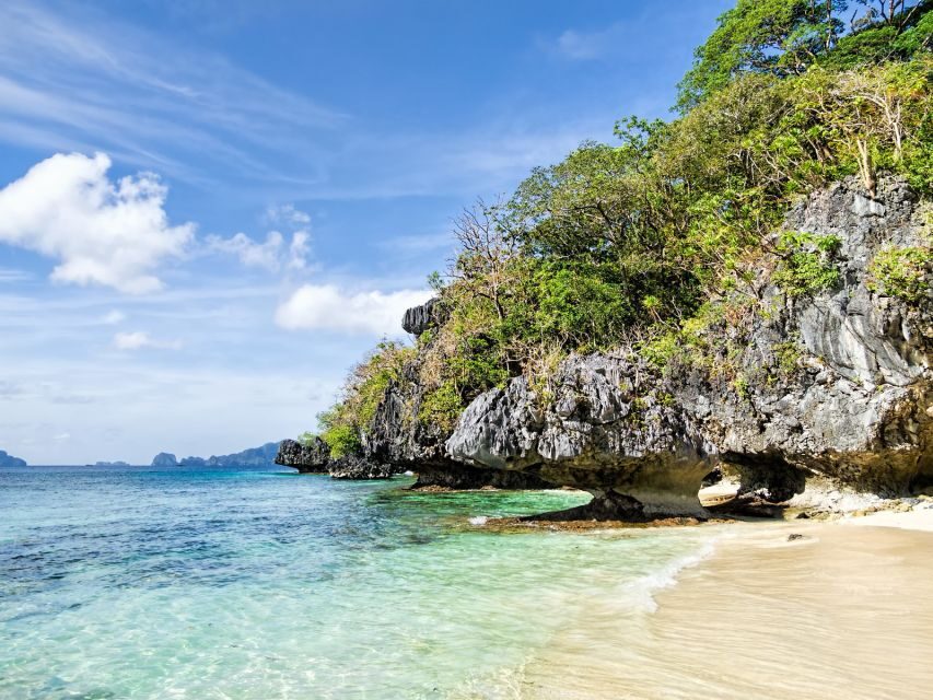 El Nido: Full-Day Premium Island Hopping Catamaran Cruise - Star Beach/Pasandigan private beach: lunch, swimming, and snorkeling focus