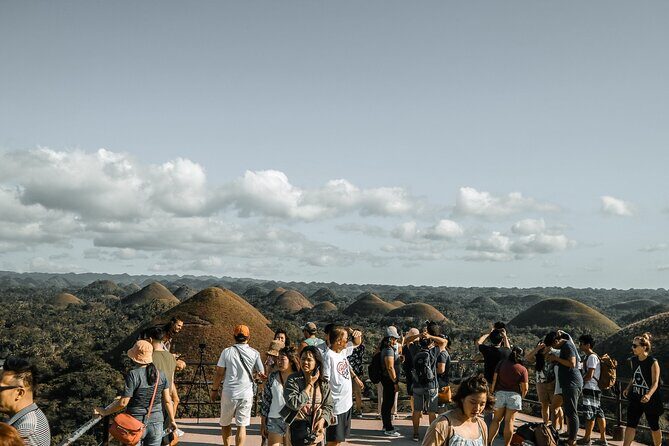 Famous Bohol Chocolate Hills Loboc River Cruise Tarsier Tour - Stop-by-stop: Sandugo Shrine and Baclayon Church in short, meaningful bites