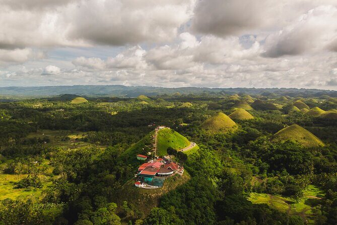 Famous Bohol Chocolate Hills Loboc River Cruise Tarsier Tour - Chocolate Hills Natural Monument: iconic views, plus time to climb