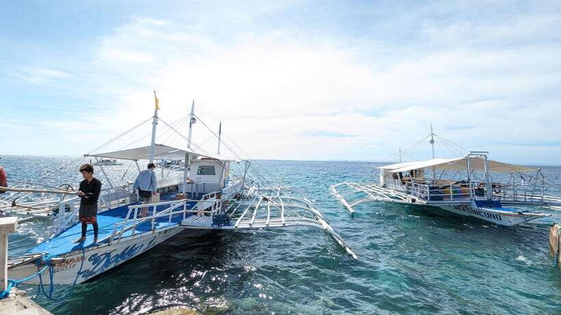 From Cebu: Island Hopping to 3 islands with BBQ lunch - Stop 2: Nalusuan Island for pier photos and easy swim breaks