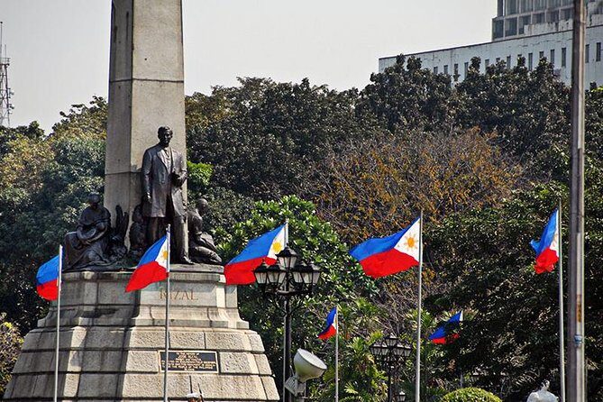Manila Old and New: Sightseeing Tour Including Intramuros and Fort Santiago - Stop by Stop: Rizal Park, Roxas Boulevard, and Modern Manila Context
