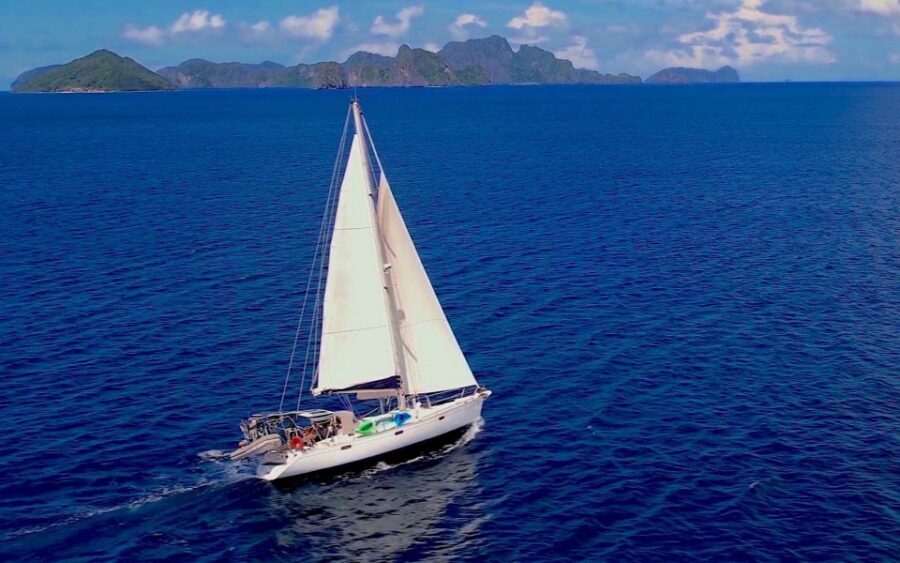 Palawan: Private Sailing Yacht Cruise in El Nido - Malpacao Island: deserted beach time, snorkeling gear, and lunch onboard