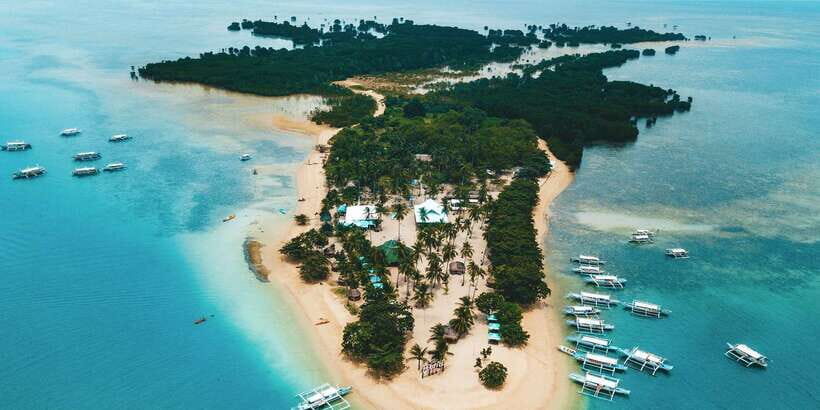 Puerto Princesa: Honda Bay Island Hopping & Optional Massage - Stop 3: Cowrie Island all-day beach time, lunch, and optional massage
